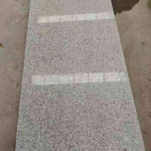 鞍山芝麻白光面毛板